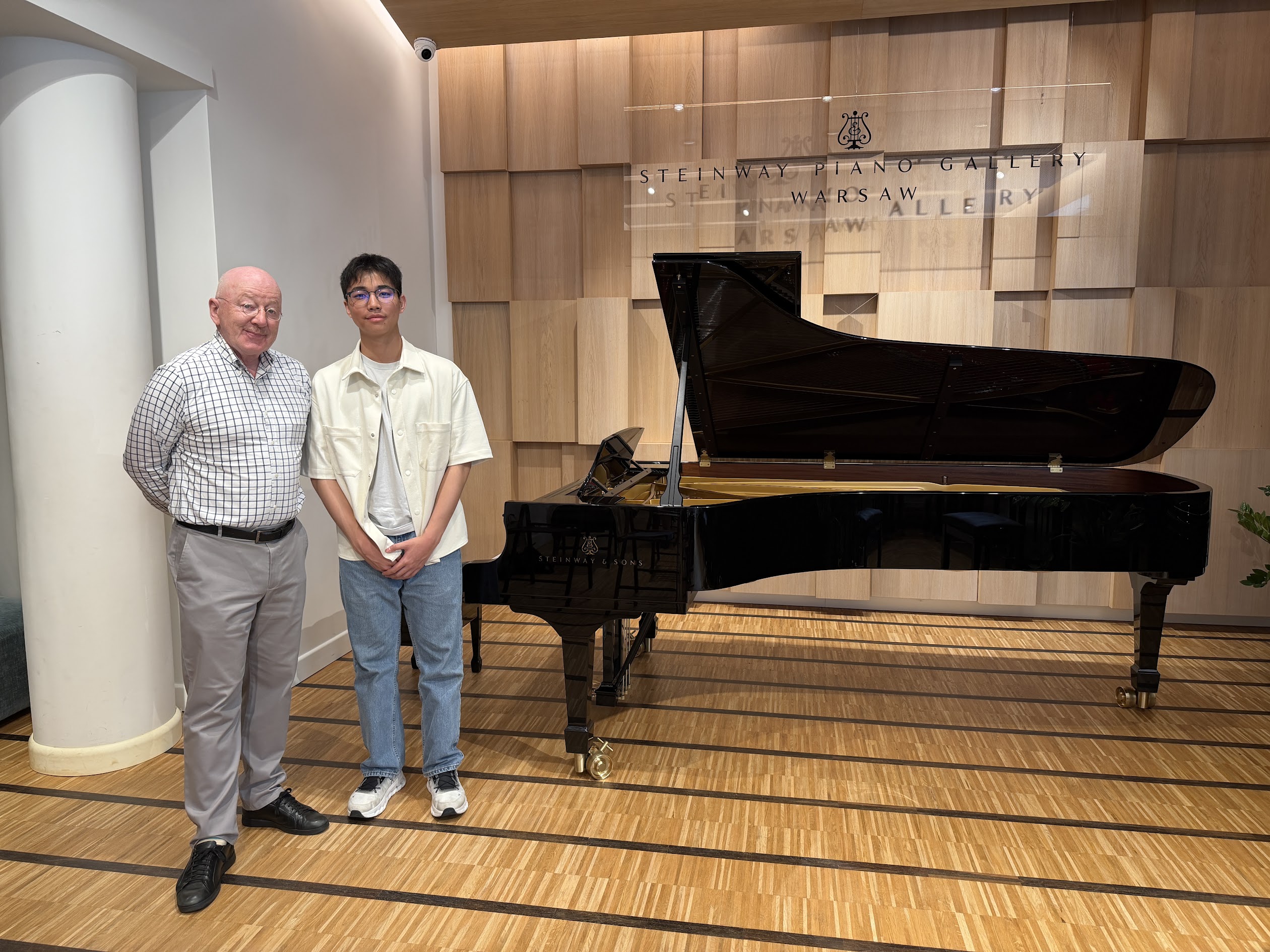 Micah Lam with Professor at Steinway Piano Gallery Warsaw